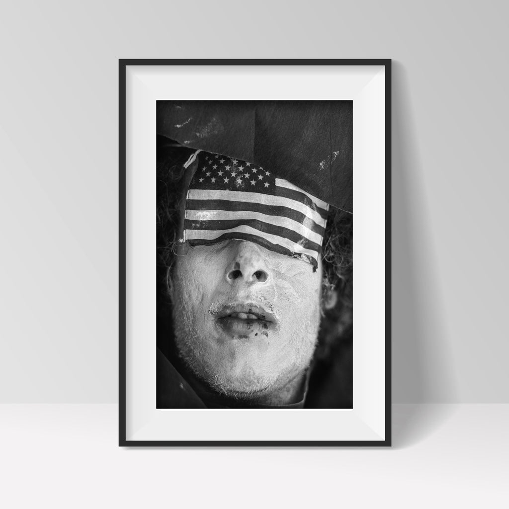 JP Laffont artwork, man with eyes covered by US flag