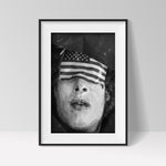 JP Laffont, man with eyes covered by US flag